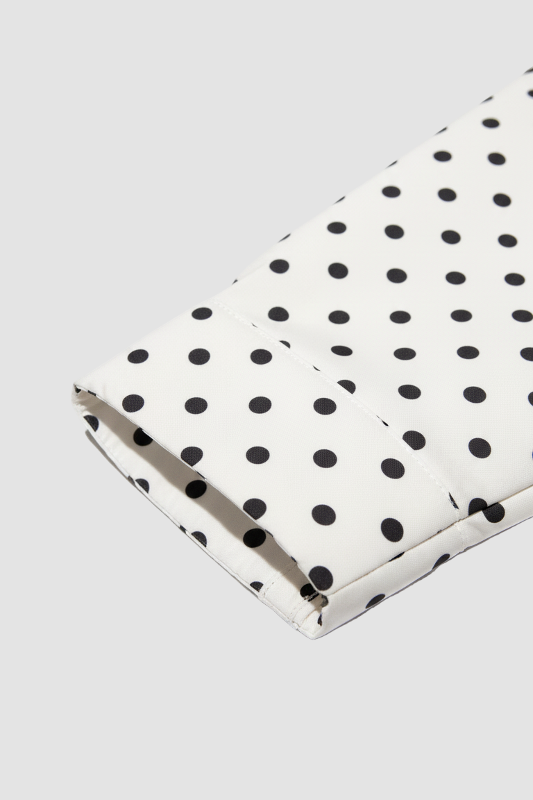 Dalvyn bomber jacket – a white cropped bomber jacket featuring black polka dots and a sleek, minimal back panel design.