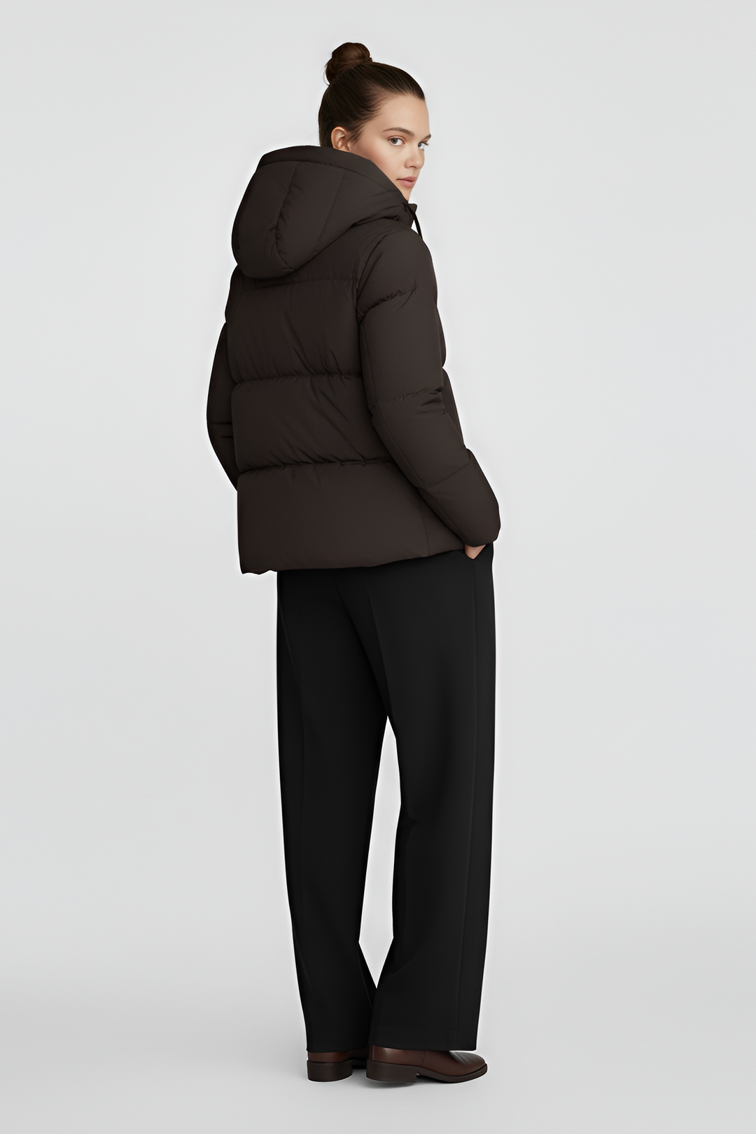 A brown puffer jacket against a light gray background.