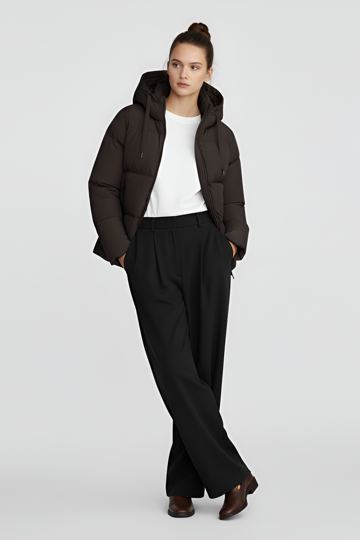 A brown puffer jacket against a light gray background.