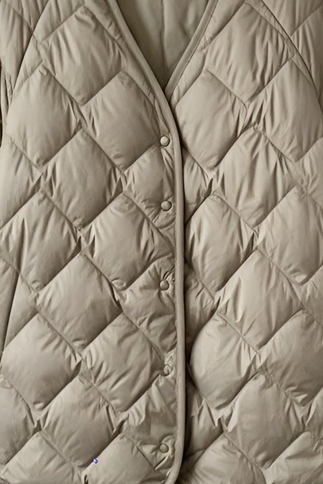 Diamond-quilt stitching detail on lightweight down jacket