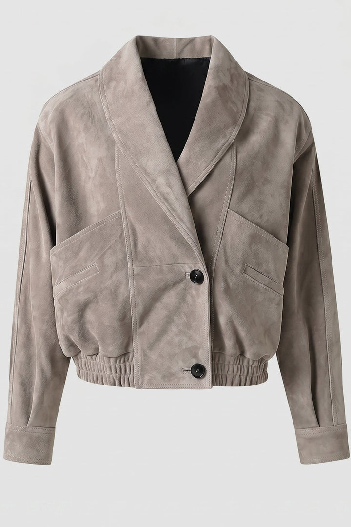 ELISE - Beige jacket with black buttons on a light gray background