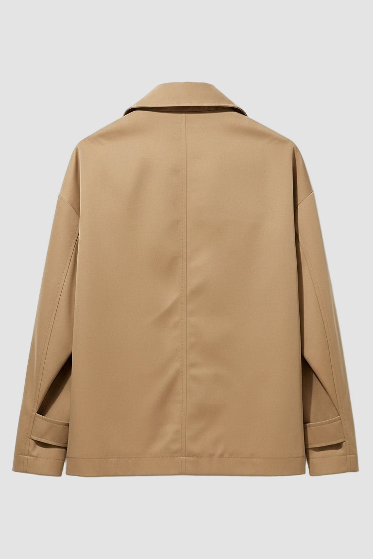 Back view of ENVARA waterproof trench coat showing long silhouette and clean seams.