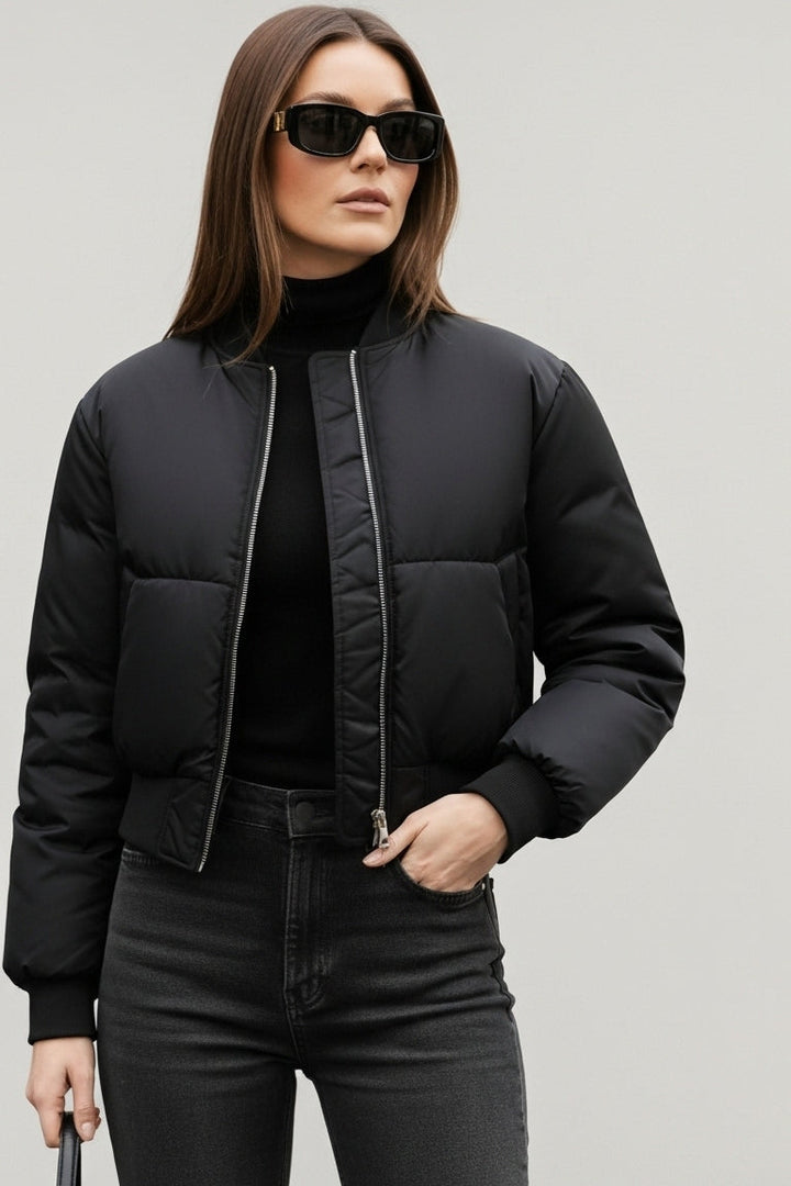 Front view of CAELIA Oversized Bomber Jacket highlighting zipper closure and padded design.