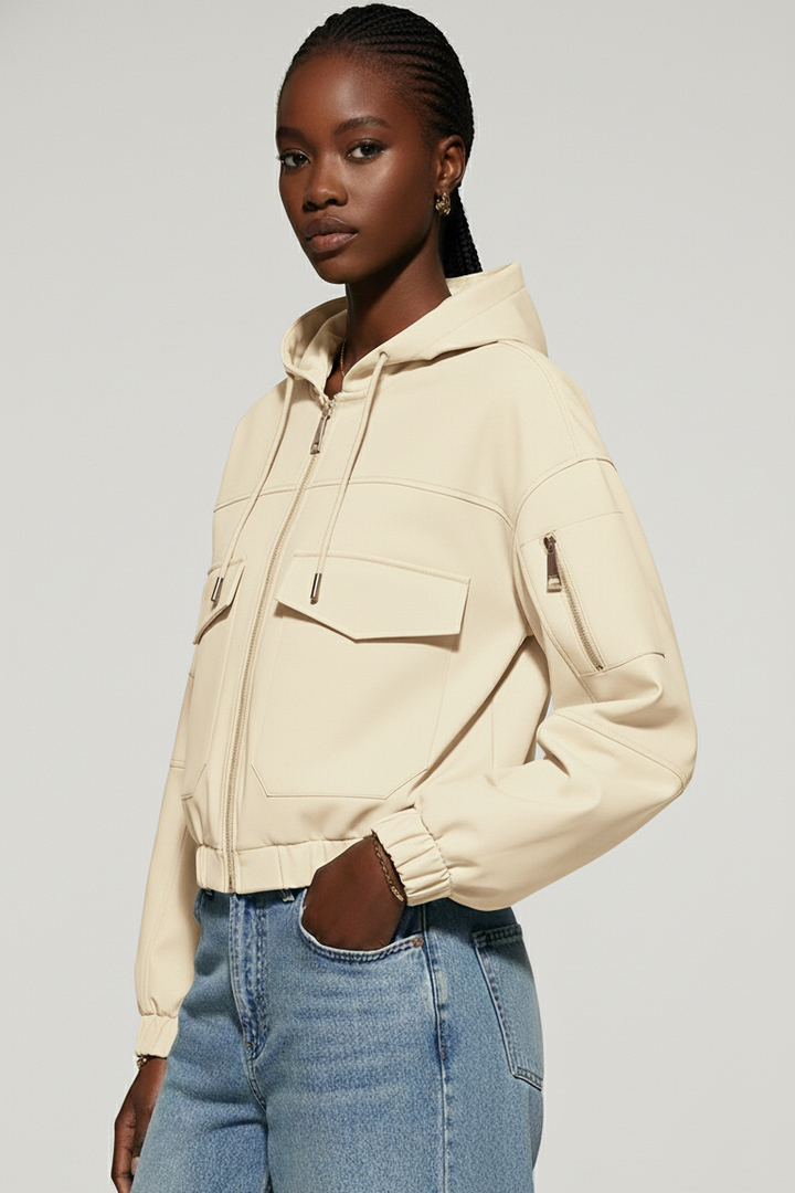 Front view of the MAERIS cropped trench coat showing pockets and minimalist solid color.