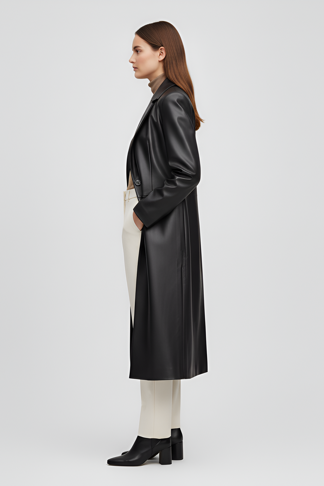 Full length PU leather trench with clean stitching and structured matte black finish