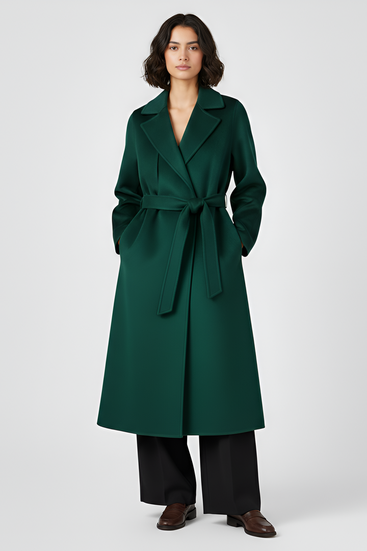 Woman wearing a green coat on a white background