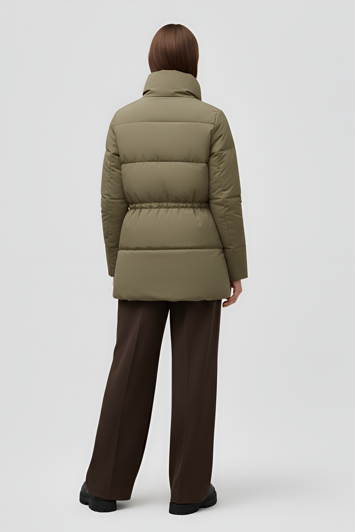 Green puffer coat on a white background