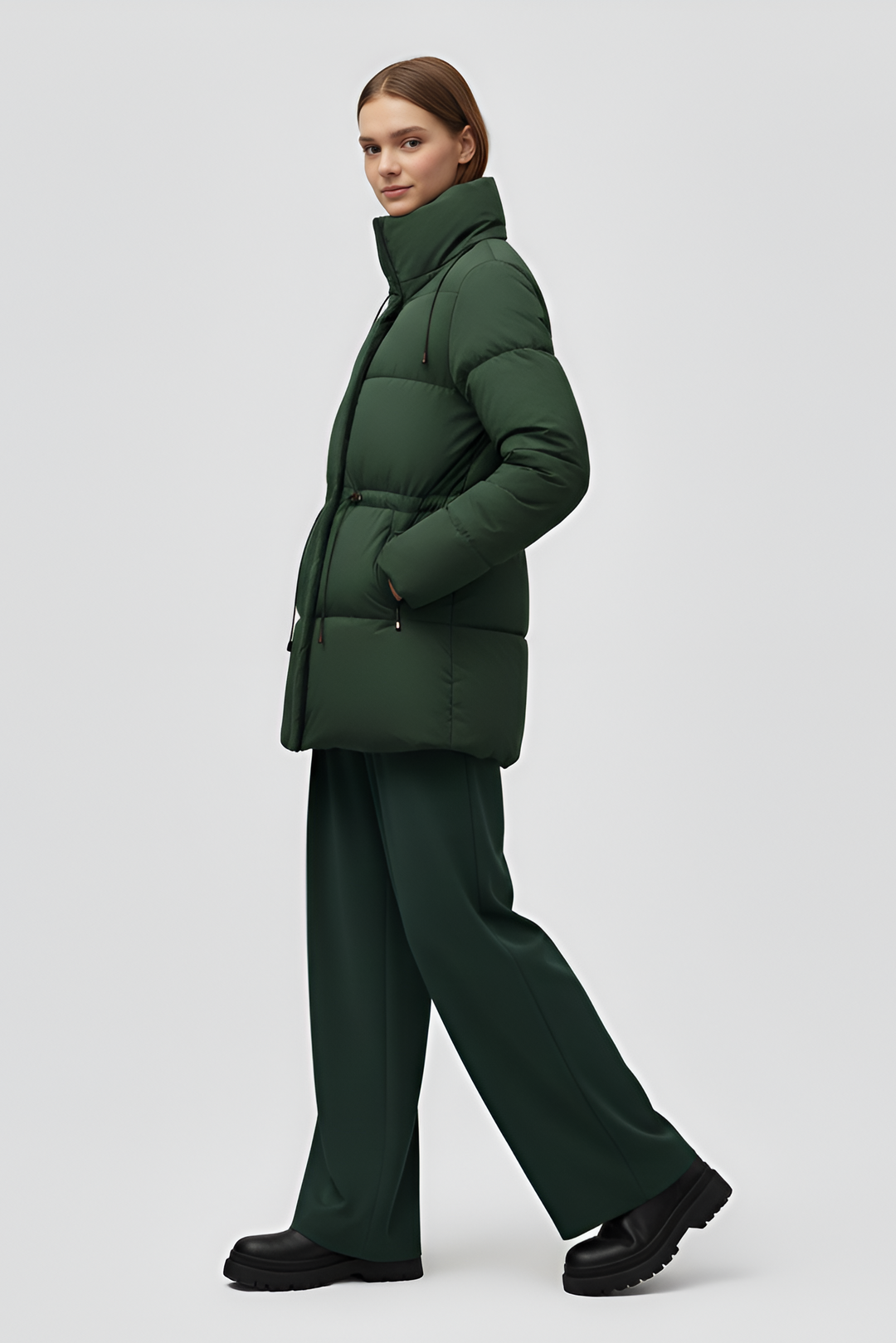 Green puffer coat on a white background