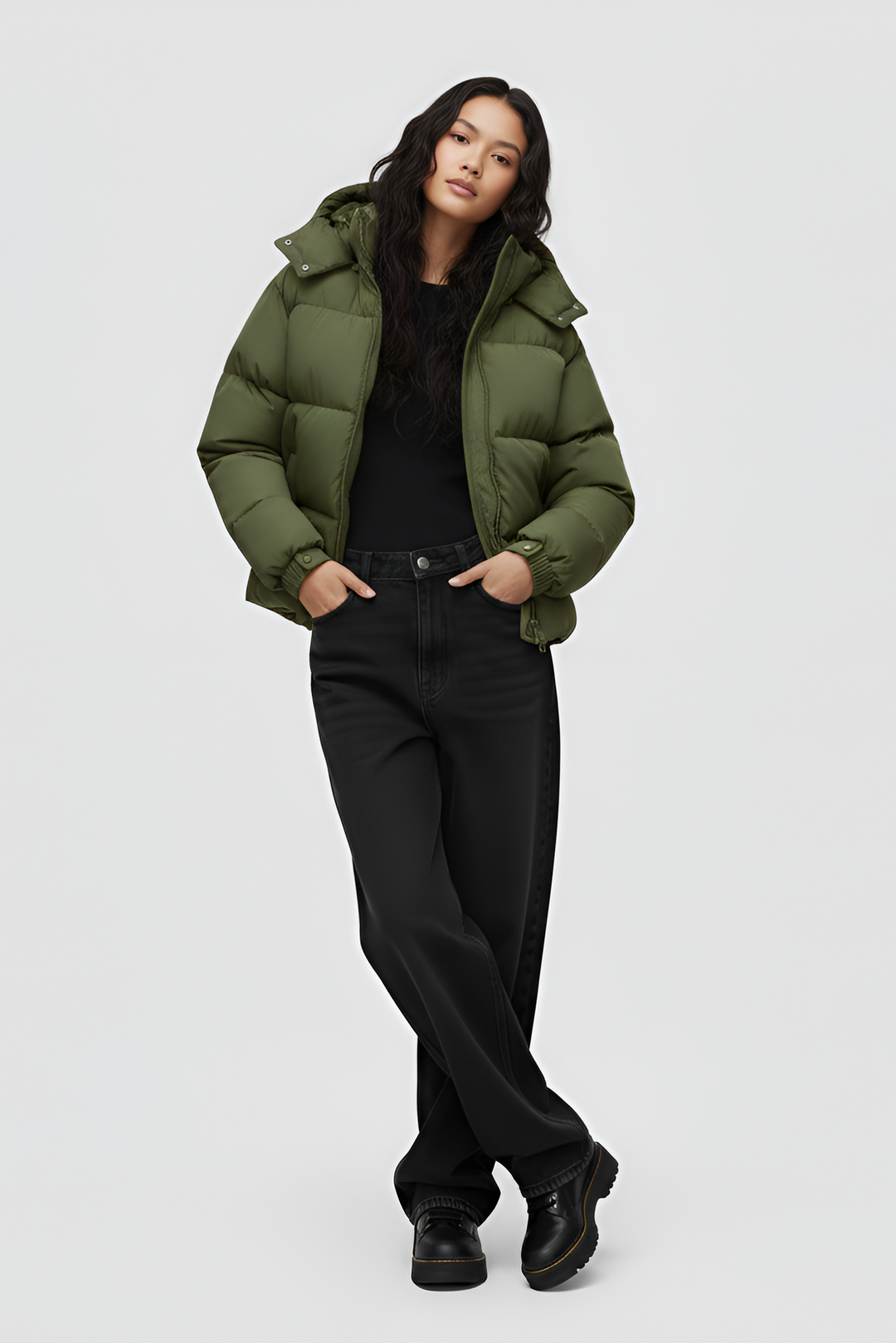 Green puffer jacket with a hood on a white background