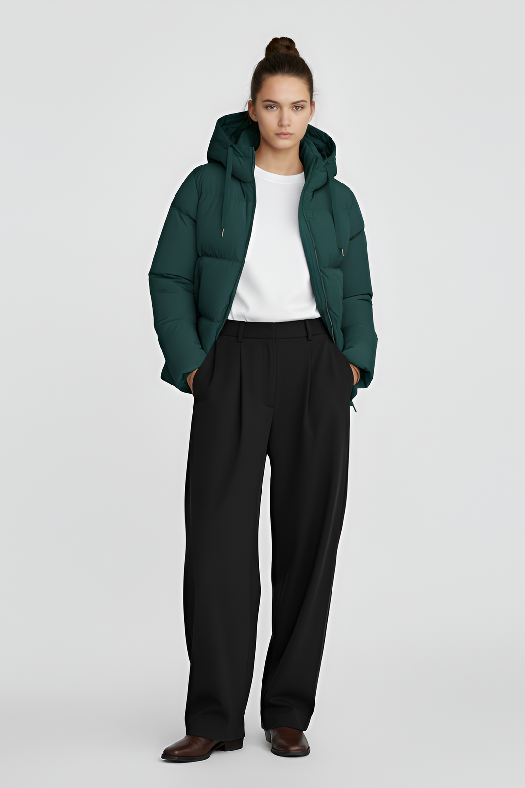 Green puffer jacket on a light gray background