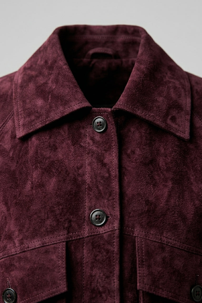 IVY - Close-up of burgundy suede jacket collar and buttons