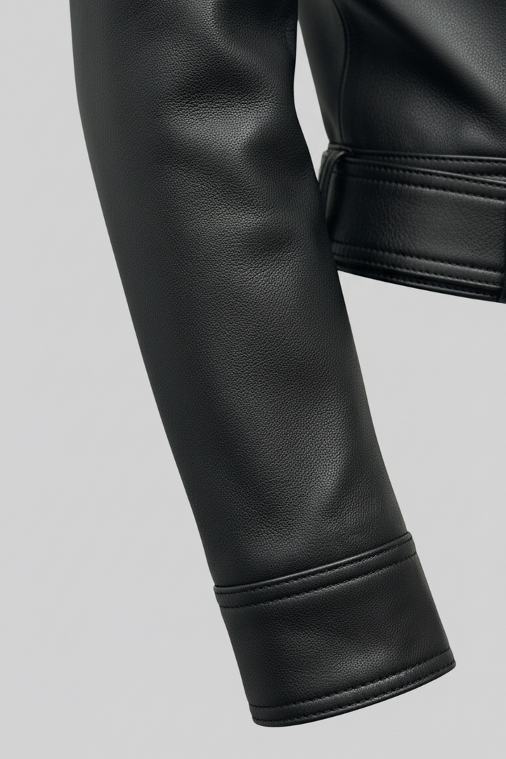 Kenzie - Close-up, black leather jacket sleeve and cuff detail