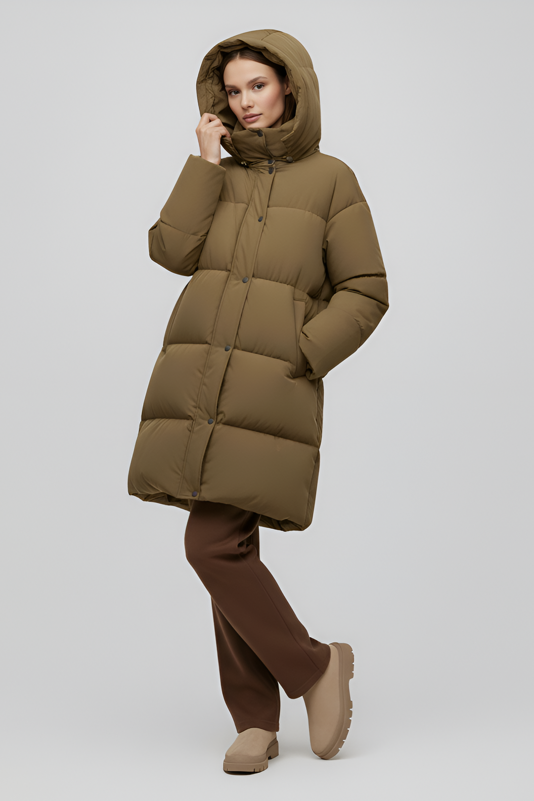 Khaki puffer coat with a hood on a white background