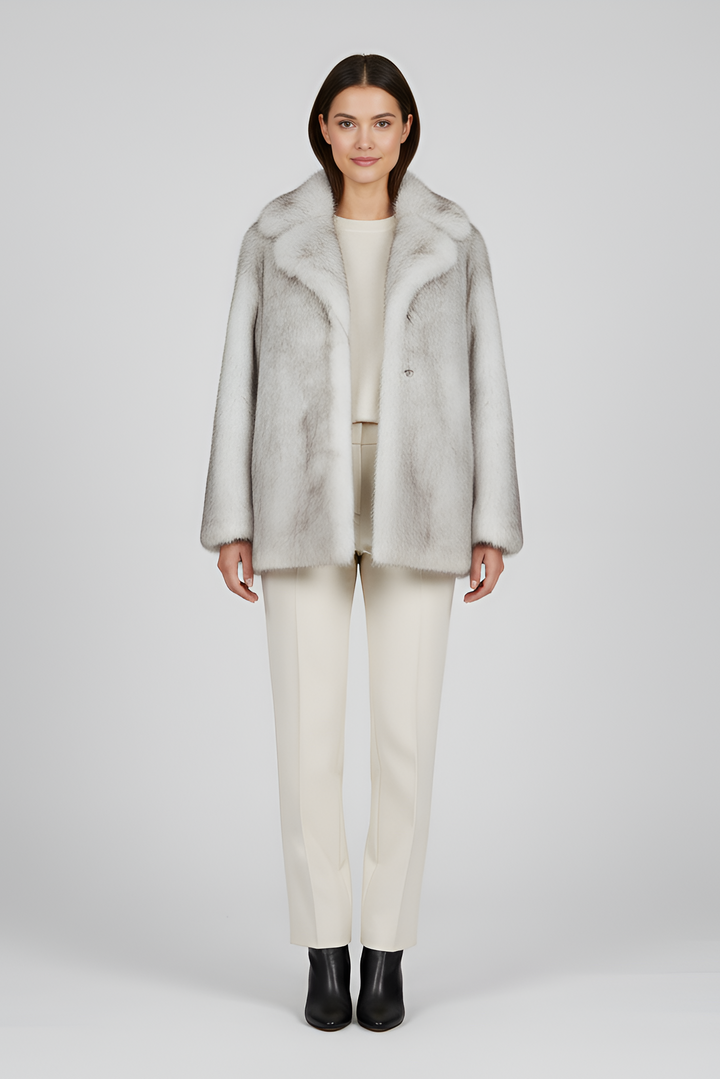 Close-up of LEOVARA coat’s fleece and wool-blend fabric with detailed leopard spots.