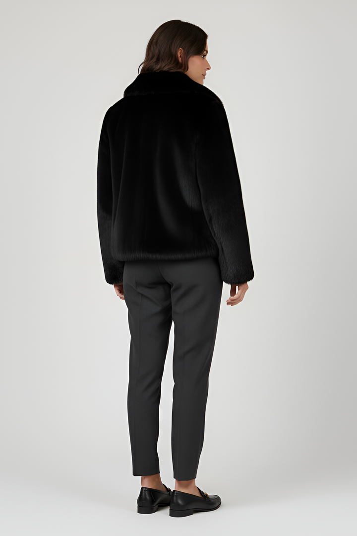 LOUVIA  faux fur long coat in black offers luxury warmth, satin lining, and timeless winter elegance.