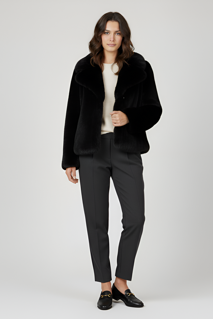 LOUVIA  faux fur long coat in black offers luxury warmth, satin lining, and timeless winter elegance.