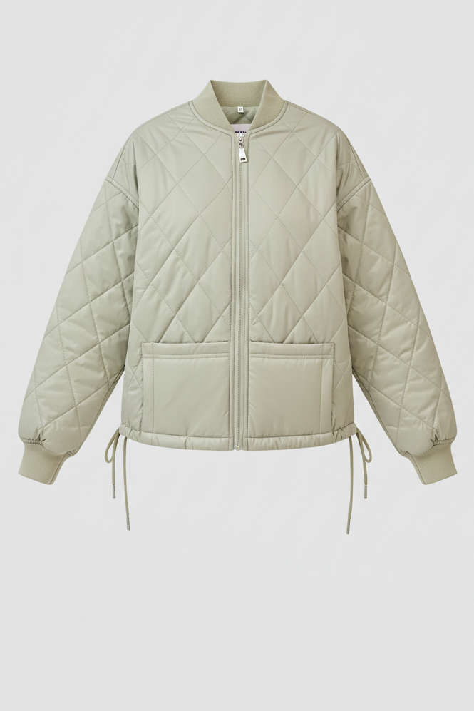 Light green quilted jacket on a light gray background