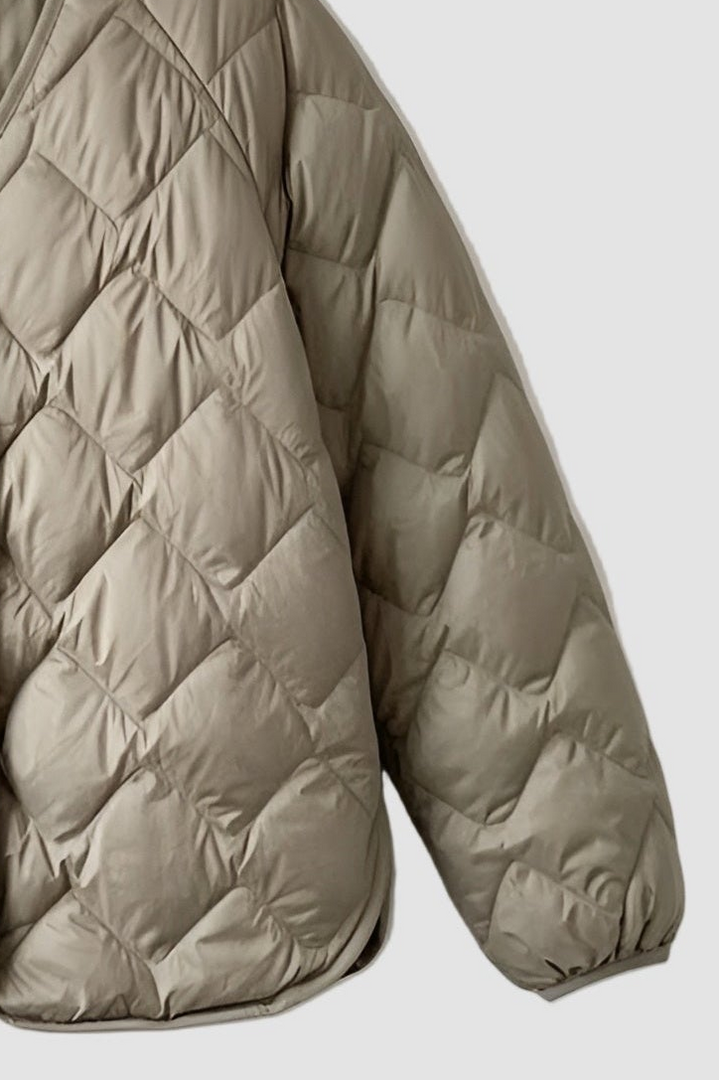 Soft duck-down padded women’s coat in neutral tone