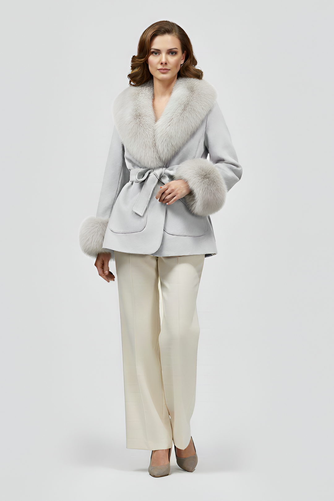 Grey faux fur winter coat for women featuring soft light faux fur shawl collar, tailored waist belt, elegant luxury outerwear close up studio view
