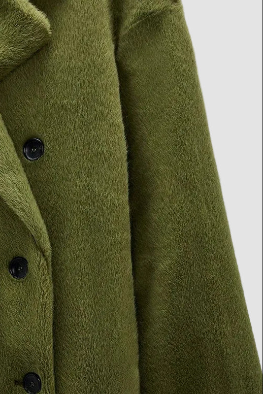 Green coat with black buttons on a white background