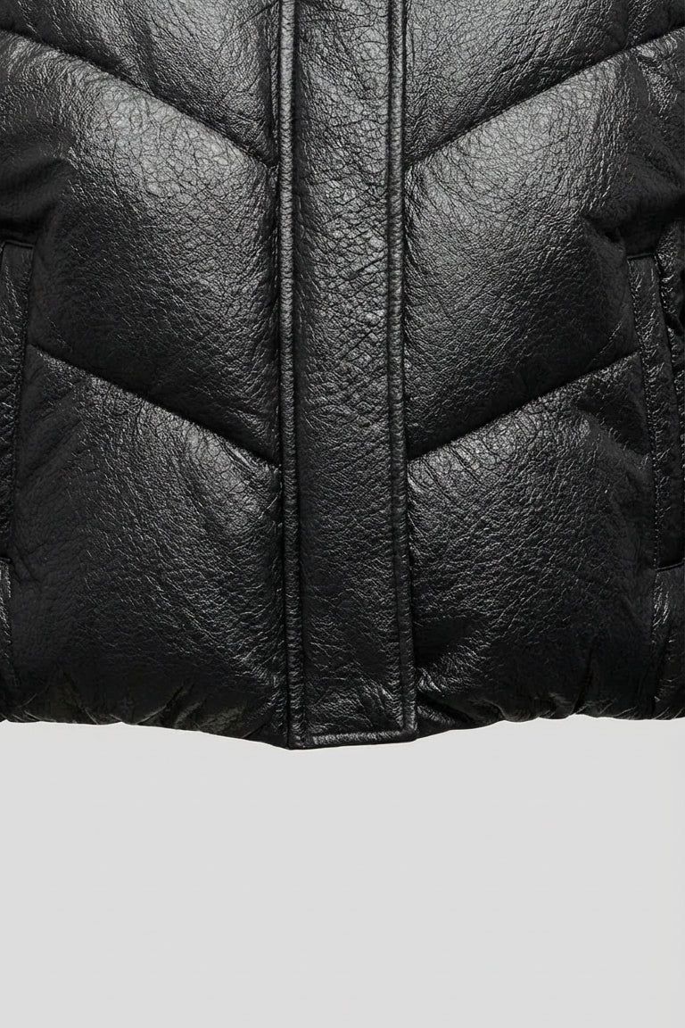 MCKENNA - Detail of black puffer jacket bottom jacket, quilted texture