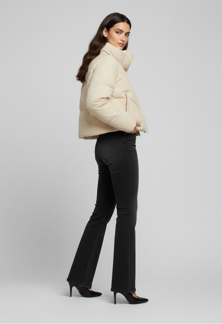 MCKENNA - Woman in cream puffer jacket, side view, posed