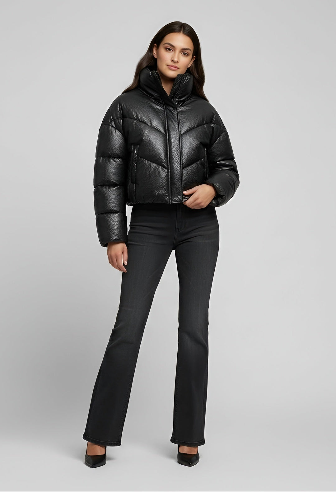 MCKENNA - Woman wearing black puffer jacket and black jeans