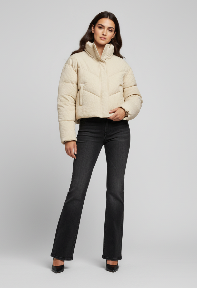 MCKENNA - Woman wearing cream puffer jacket and black jeans, full body shot