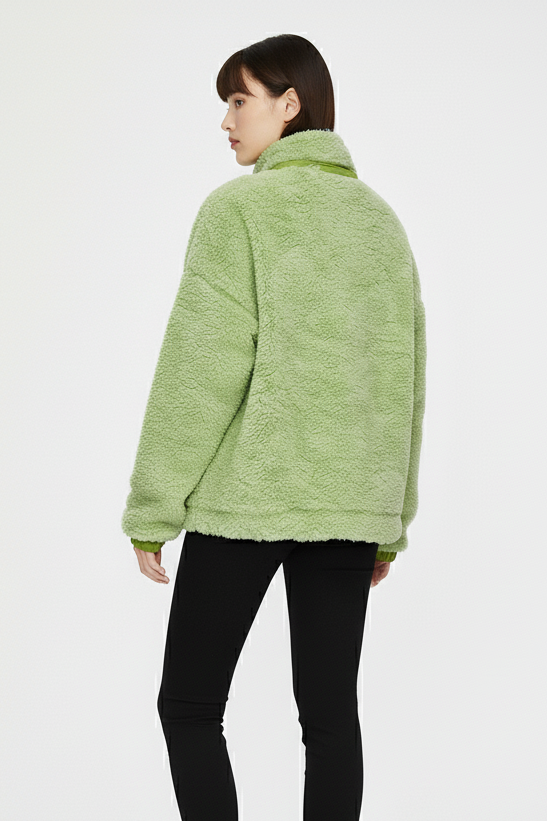 Back view of green women’s shearling jacket showing relaxed silhouette