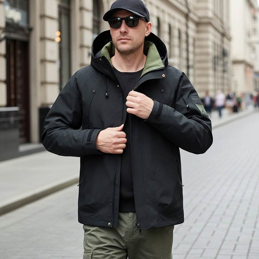 Man wearing a black jacket with green lining on a city street