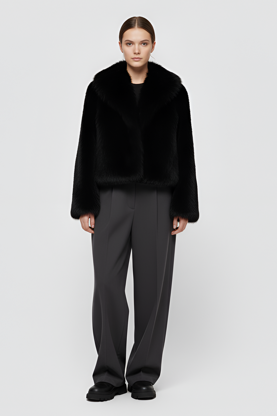 Detailed front view of the Camelia faux fur winter coat in Midnight black, highlighting its rich texture and satin inner lining.