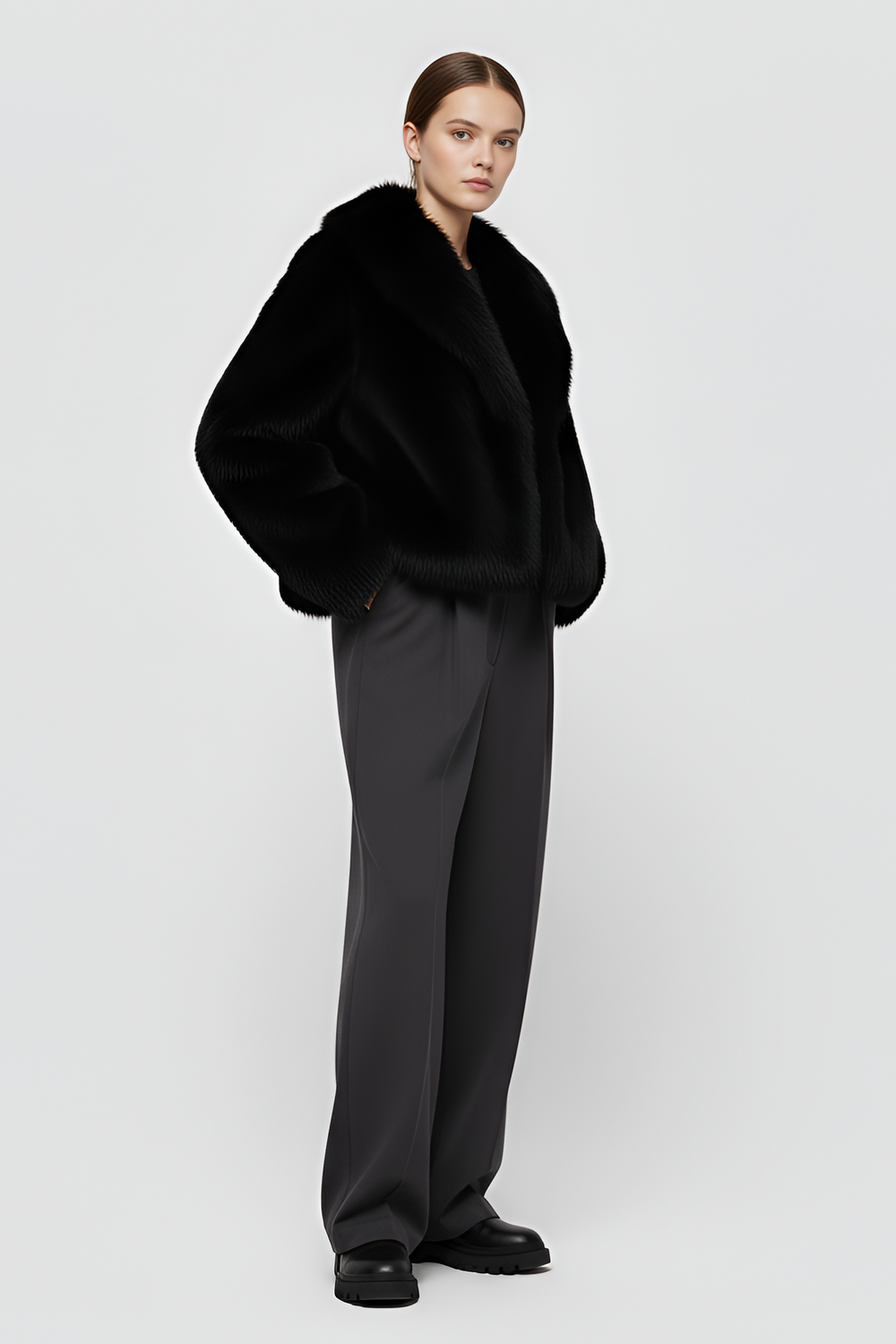 Detailed front view of the Camelia faux fur winter coat in Midnight black, highlighting its rich texture and satin inner lining.