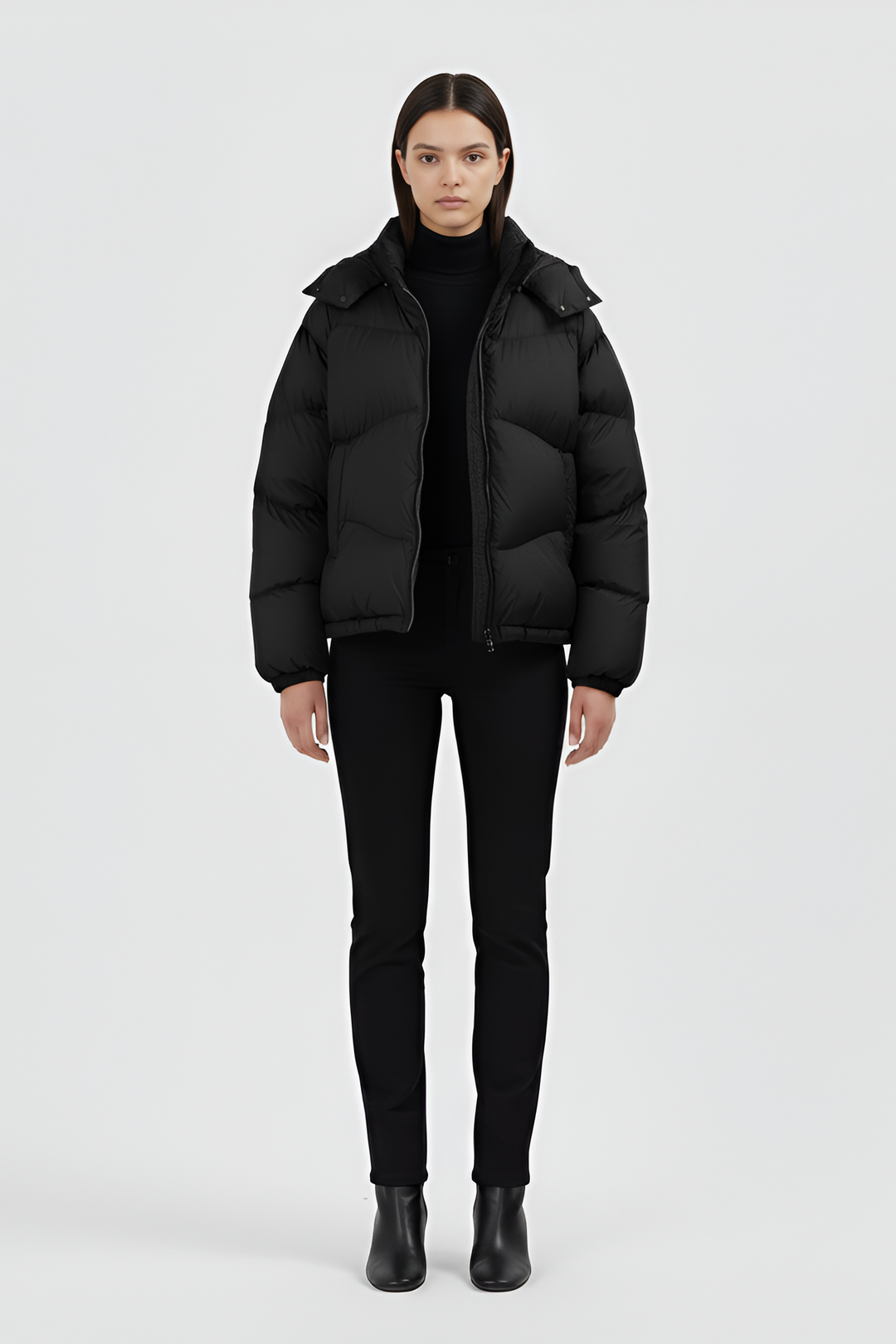 Model standing in LYORE Down Jacket, minimal studio background emphasizing sleek silhouette.