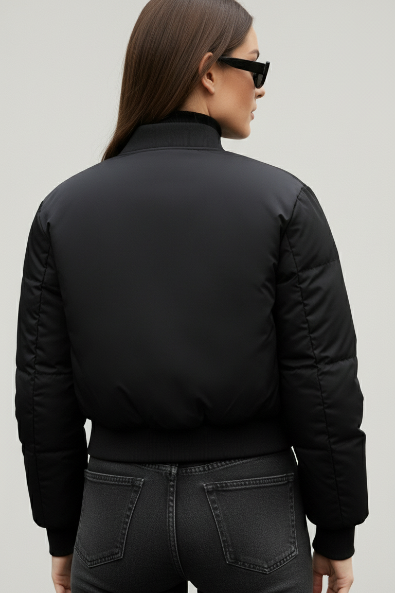 Model styling CAELIA Oversized Bomber Jacket for a modern urban winter streetwear look.