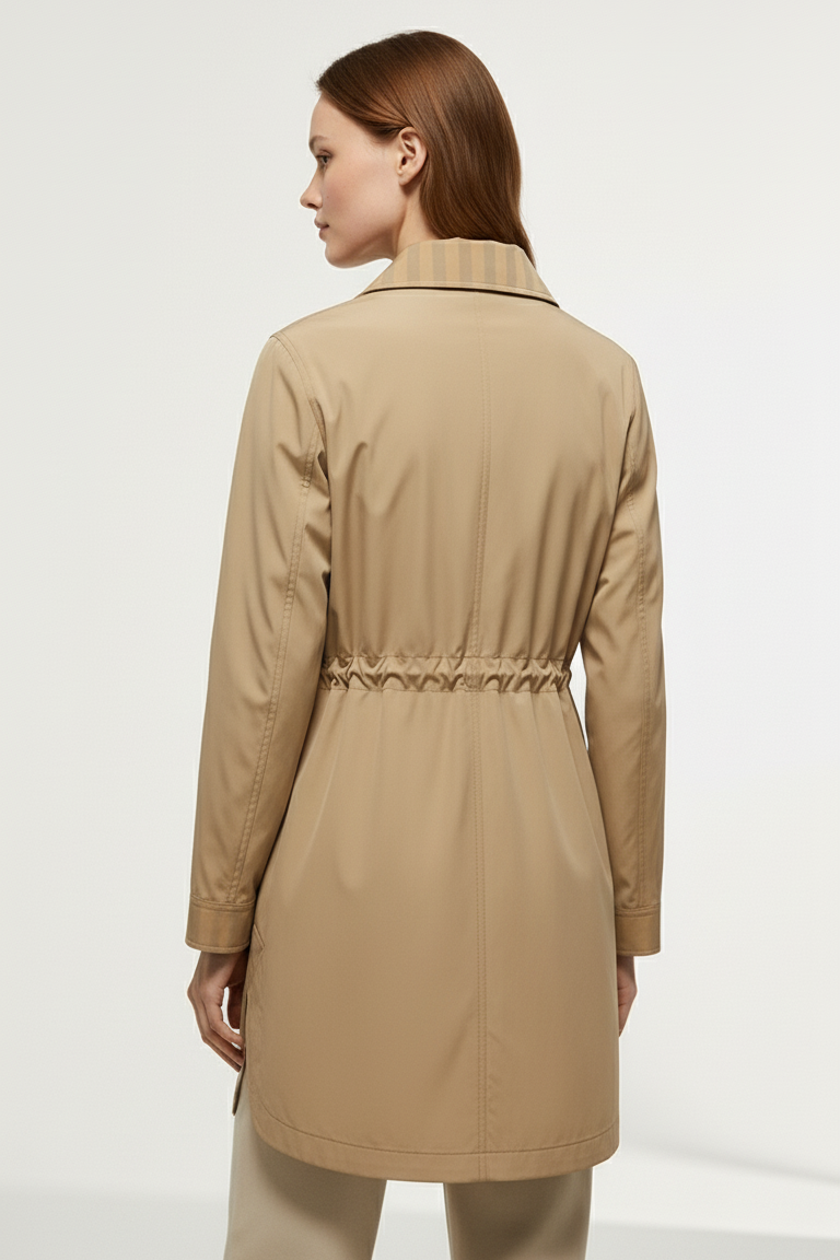 Model styling EVELON Spring Trench Coat for a casual spring look with minimalist background.