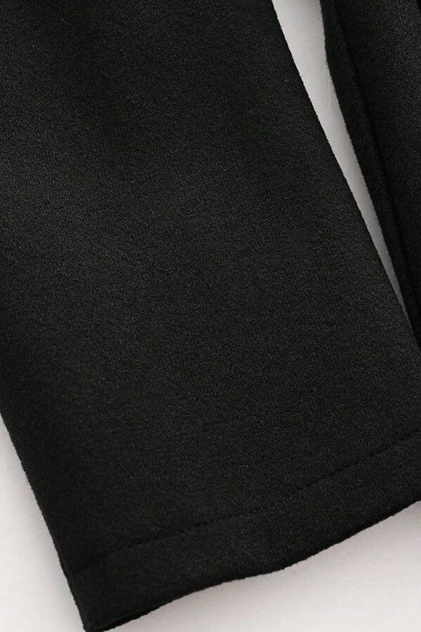 Model styling LEONA Wool Blend Long Coat with chic all-black outfit for modern elegance.