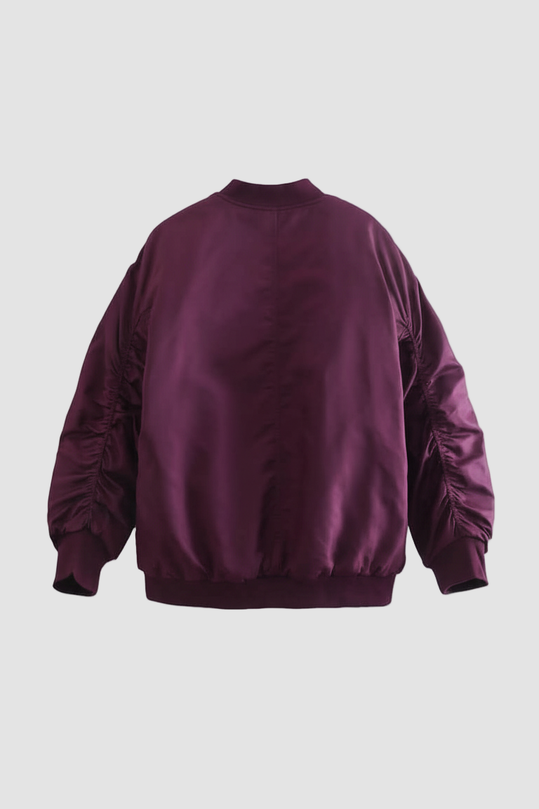 Model styling LYRIEL Purple Puffer Bomber Jacket for casual fall and winter everyday wear.