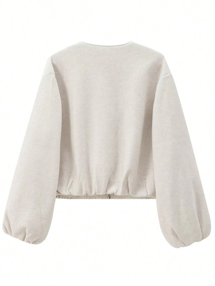 Model styling VALERINE Velvet Bomber Jacket for a casual autumn-winter street look.