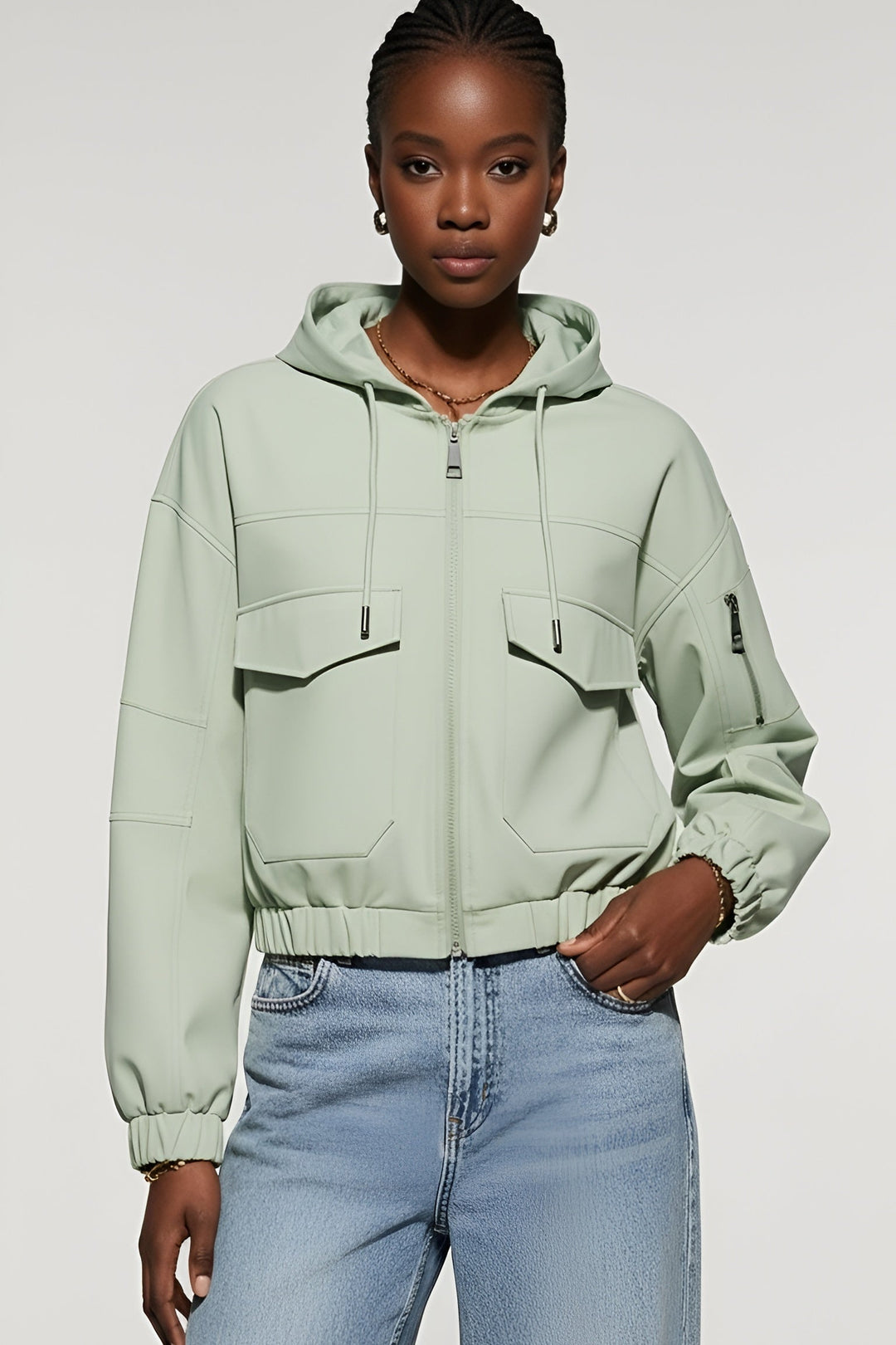 Model wearing the MAERIS Hooded Cropped Trench Coat with full zipper and hood.