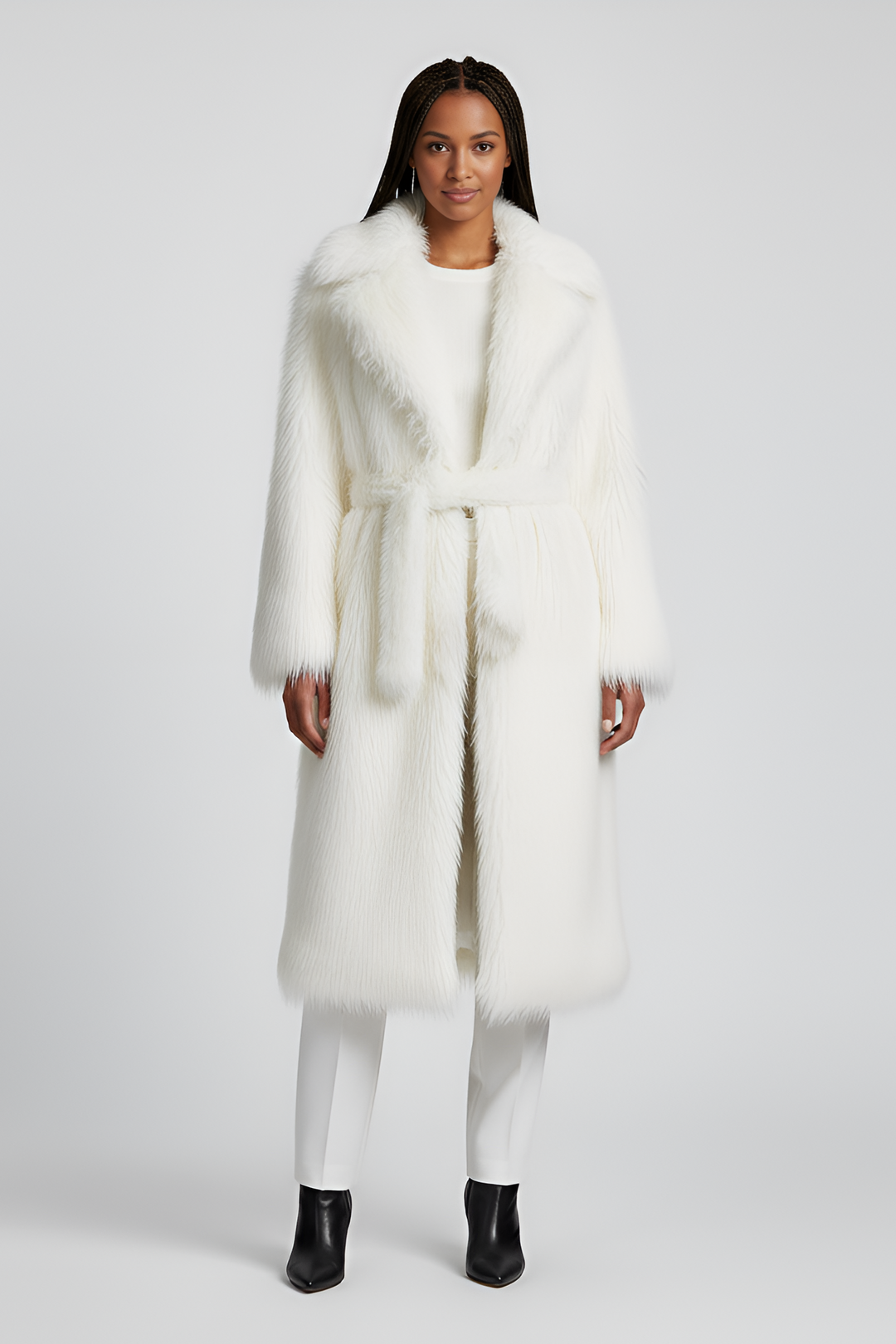 Model wearing the MARZELA long fur coat in natural winter light.