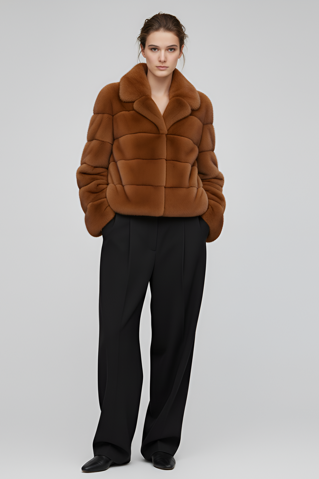 Model wearing the VELARIE faux fur coat in a winter outdoor setting.