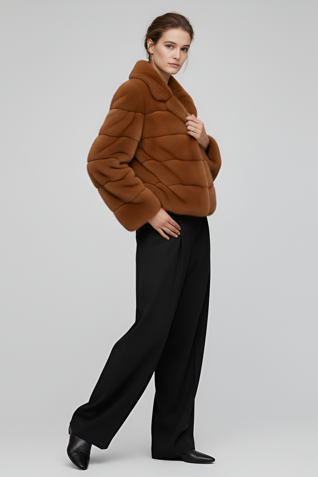 Model wearing the VELARIE faux fur coat in a winter outdoor setting.