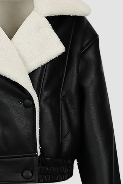 Modern black shearling coat with oversized collar, button closure and clean cropped waist