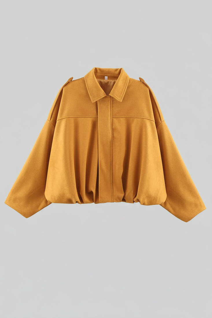 Mustard yellow shirt on a light gray background