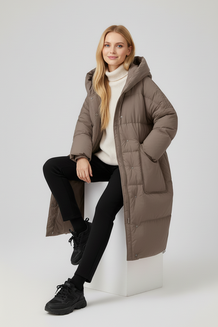 NORAVEN Hooded Down Coat – Model standing wearing taupe down coat
