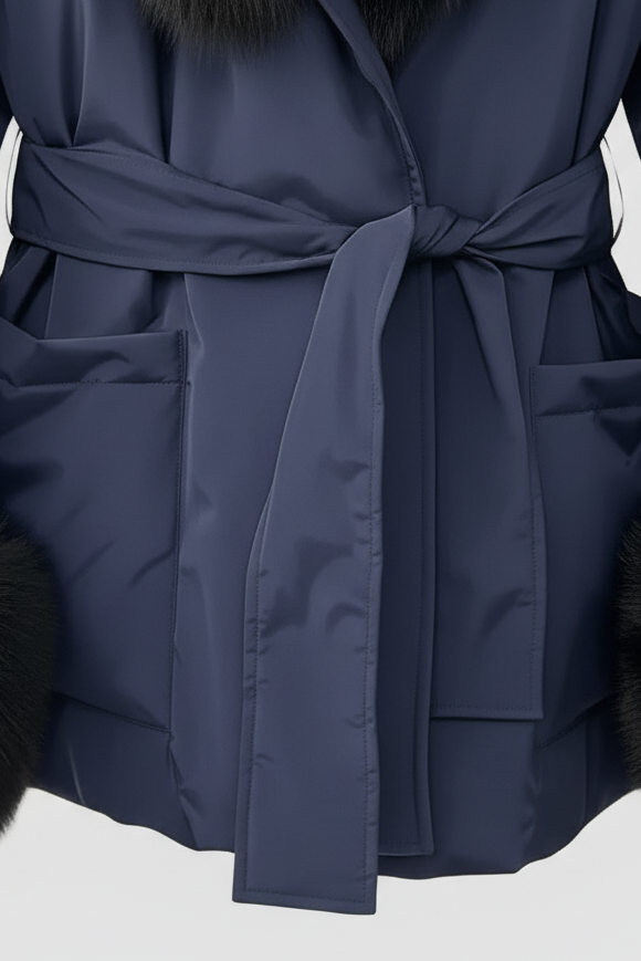 Navy blue coat with fur trim on a light gray background
