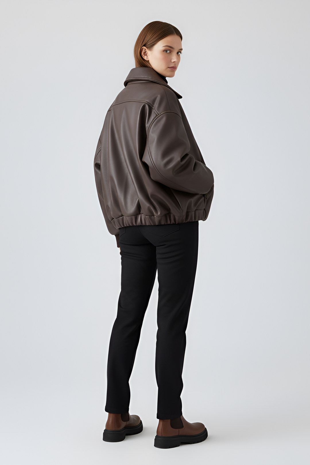 Oversized faux leather cropped jacket brown worn by model with leather pants