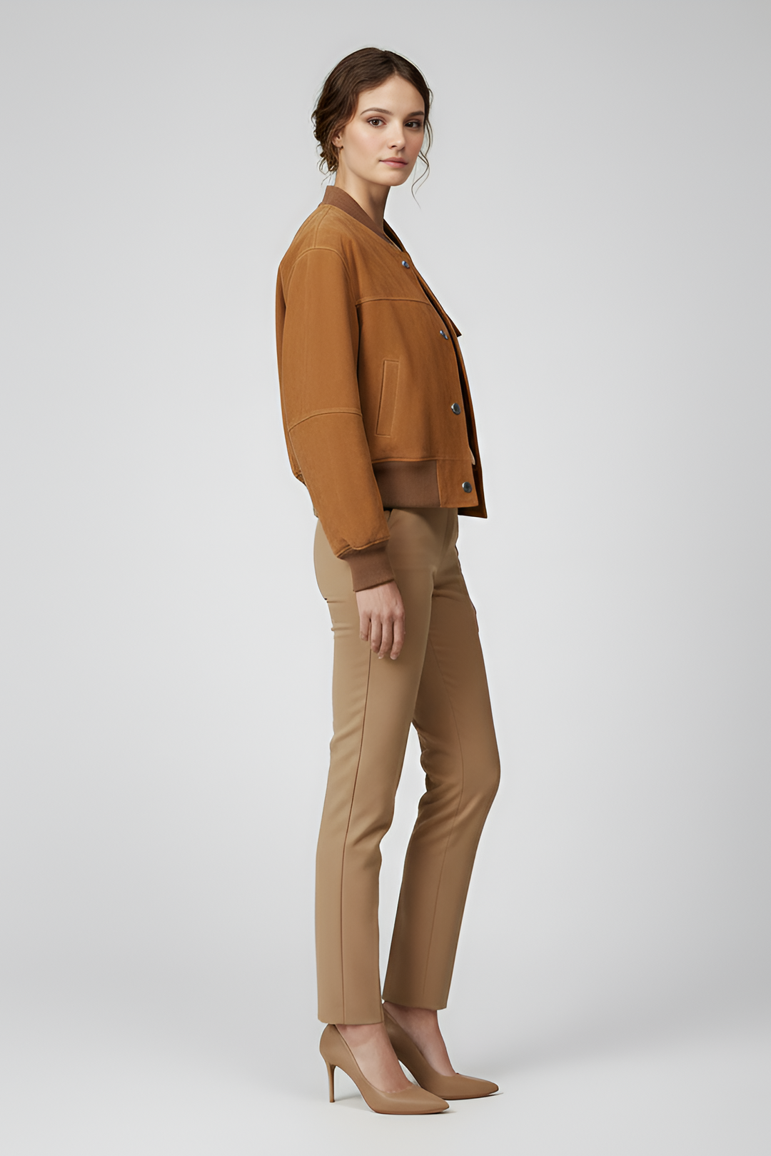 PRESLEY - Woman in bomber jacket and slim-fit pants, Side profile view