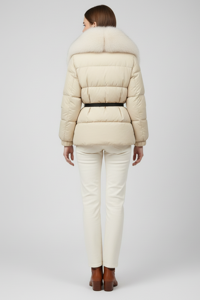 Person wearing a beige puffer jacket and pants on a white background