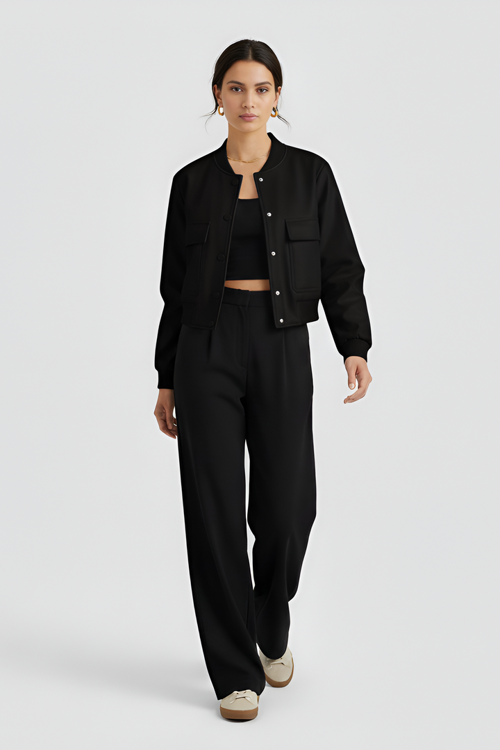 Person wearing a black outfit on a white background